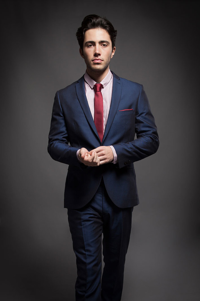 Navy blue suit, light red shirt and red tie color combination