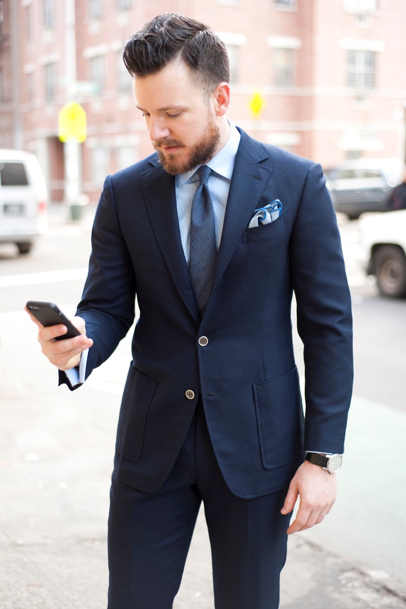 Navy blue suit, light blue shirt, blue tie mixed with brown shoes