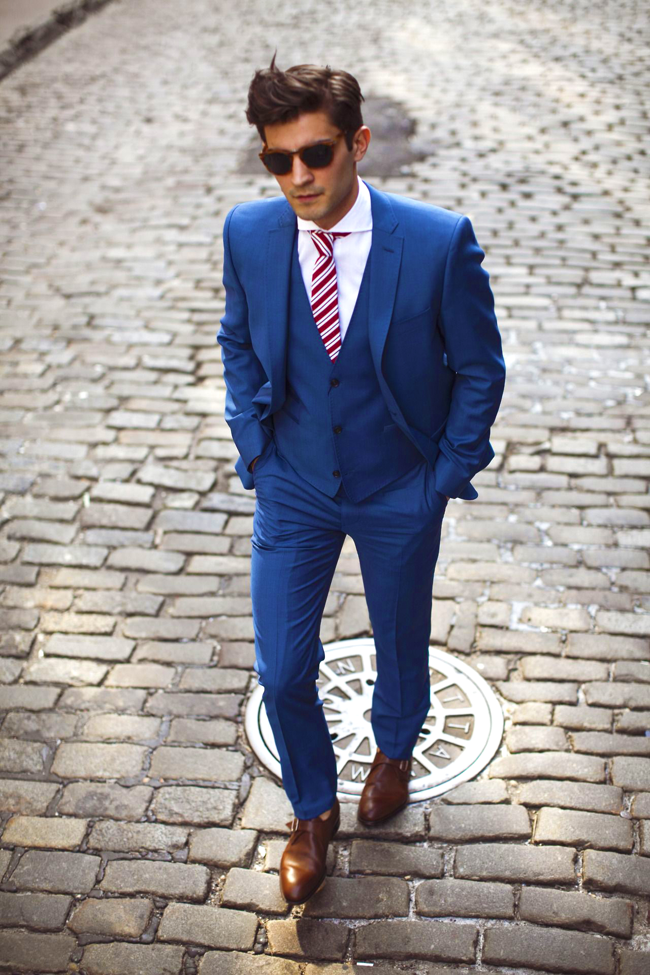 Brown monkstraps matched with a white dress shirt and blue suit