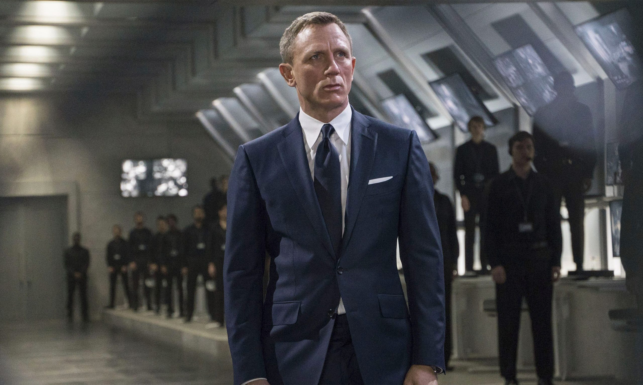 James Bond wears a navy sharkskin suit in Spectre