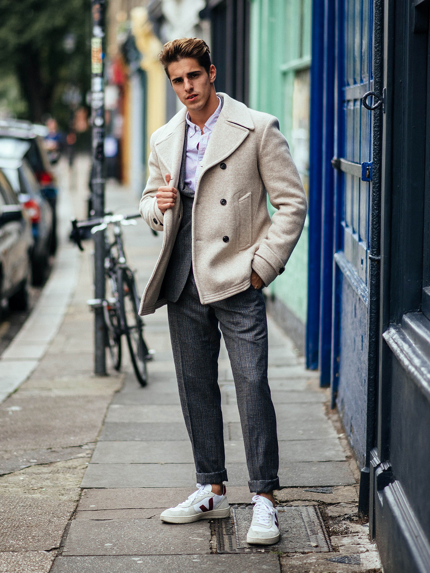 beige peacoat, casual grey suit, and striped button-down shirt