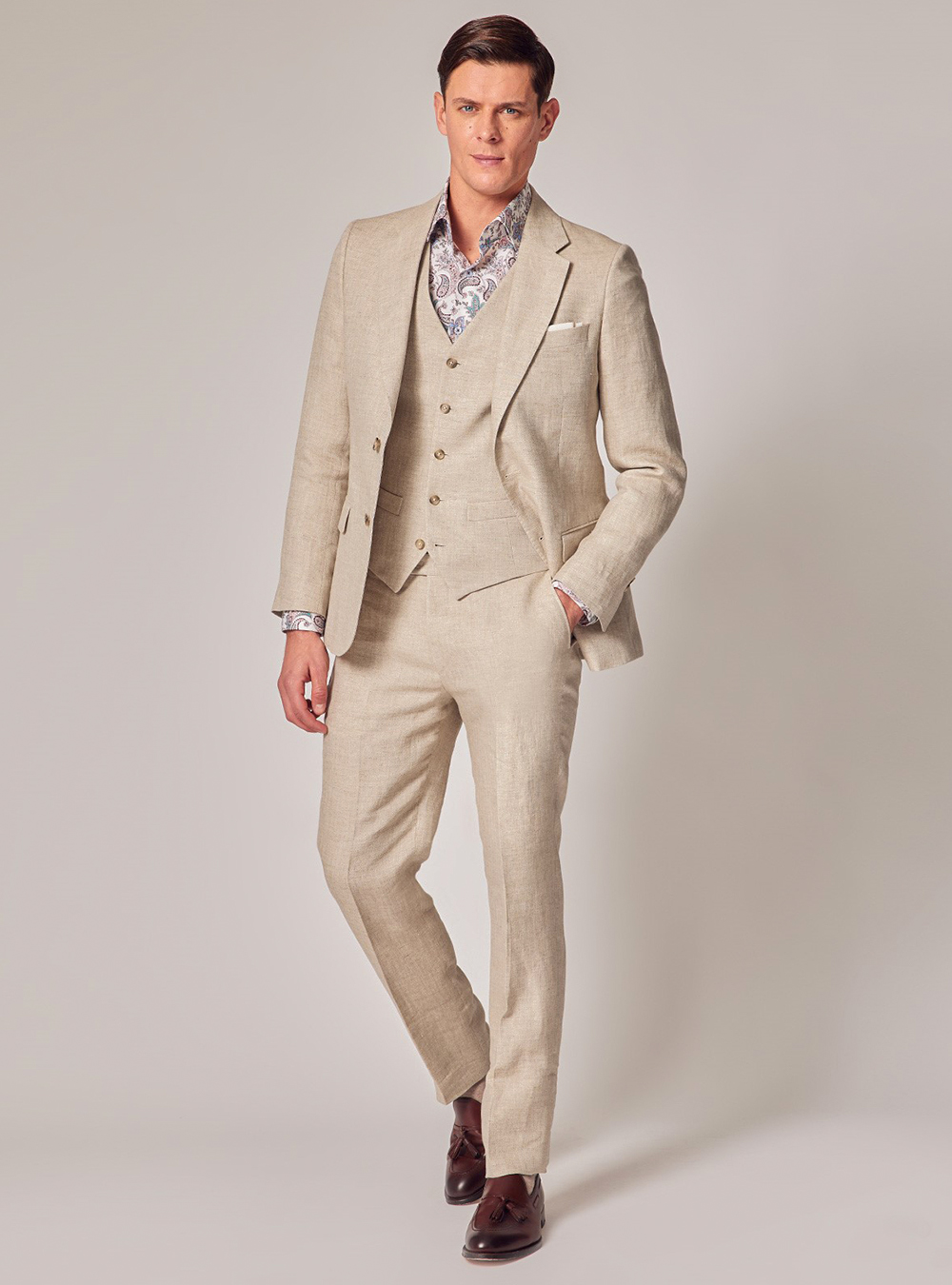 Beige three-piece suit, floral dress shirt and burgundy tassel loafers