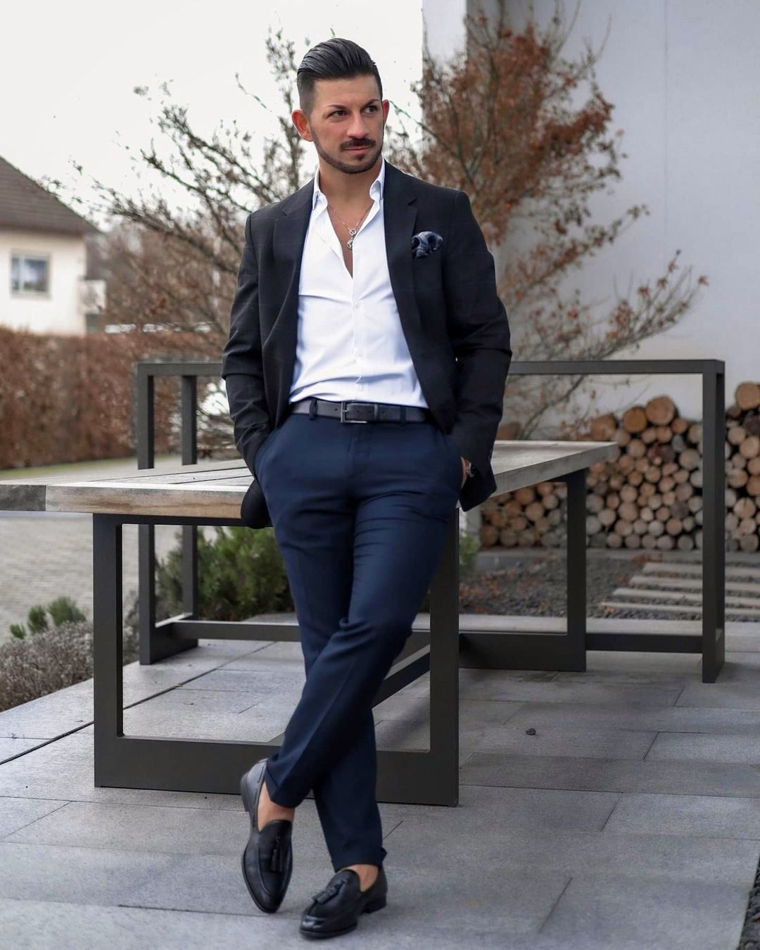 Black blazer, white shirt, navy trousers, and black loafers