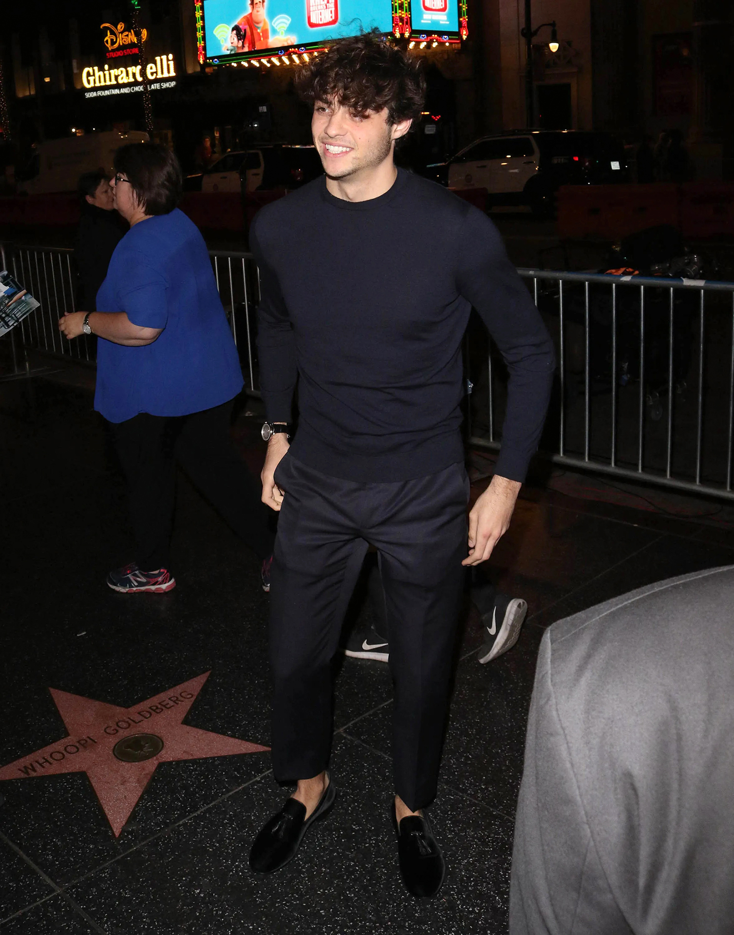 black crewneck sweatshirt with black loafers and dress pants for nighttime wear