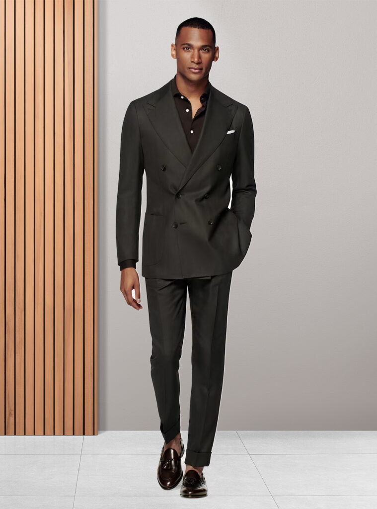 black suit with brown polo sweater and loafers