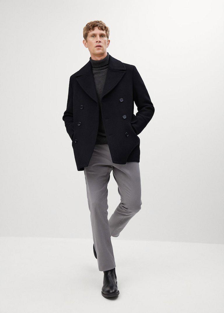 black peacoat, charcoal turtleneck, grey chino pants, and black chelsea boots