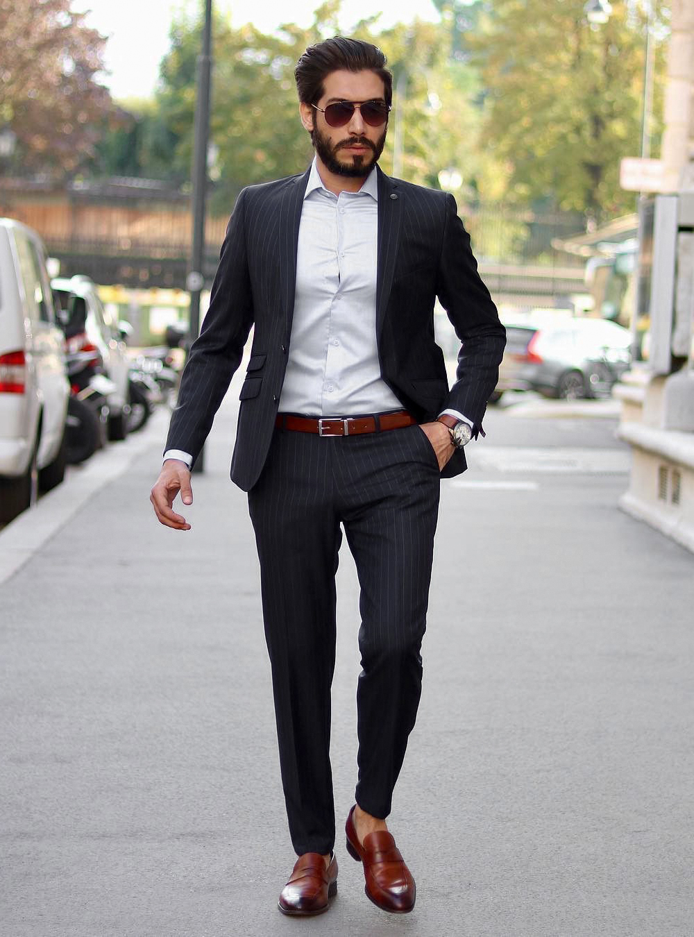 black suit, white dress shirt, and brown loafer shoes
