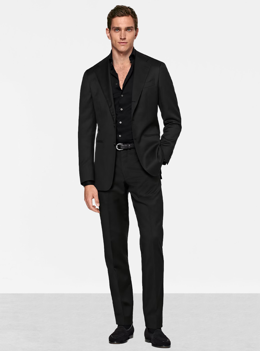 Black suit, black dress shirt and black suede loafers