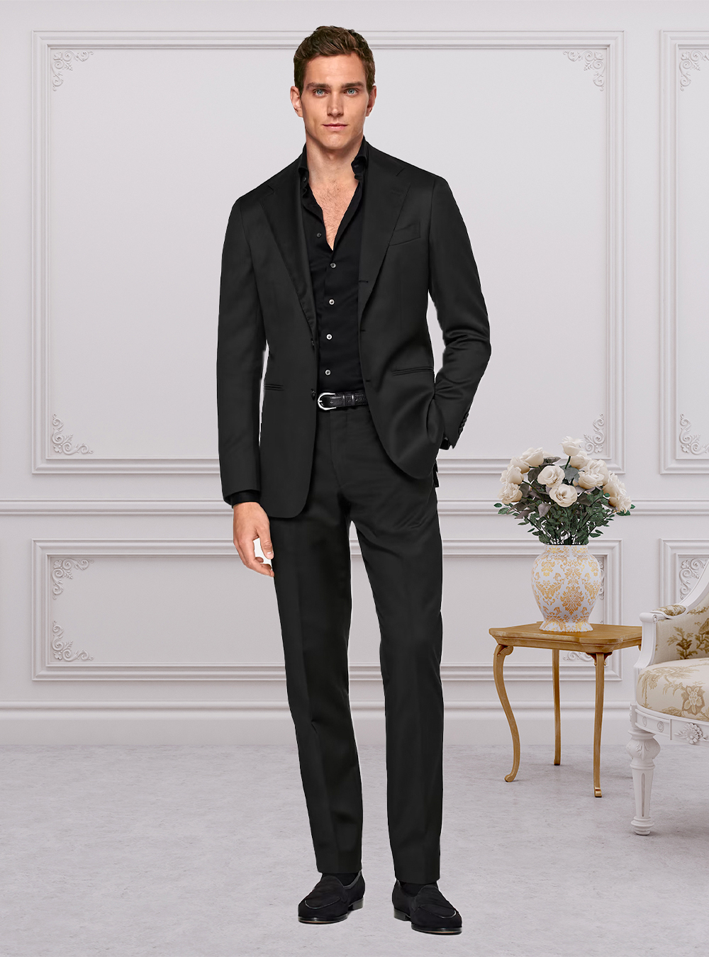 Black suit, black dress shirt and black suede loafers