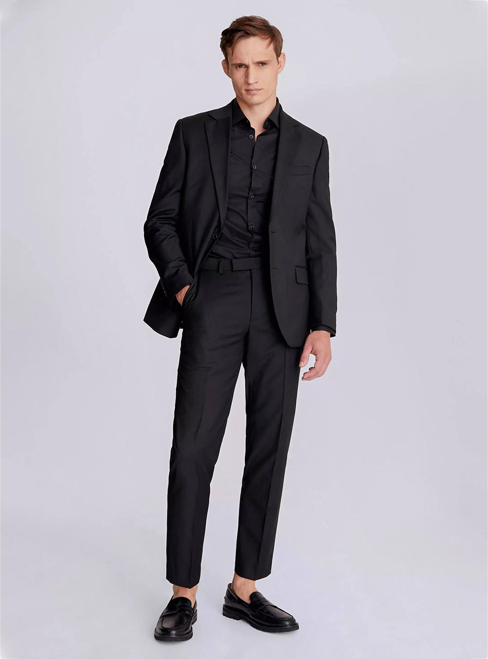 Black suit, black shirt and black loafers