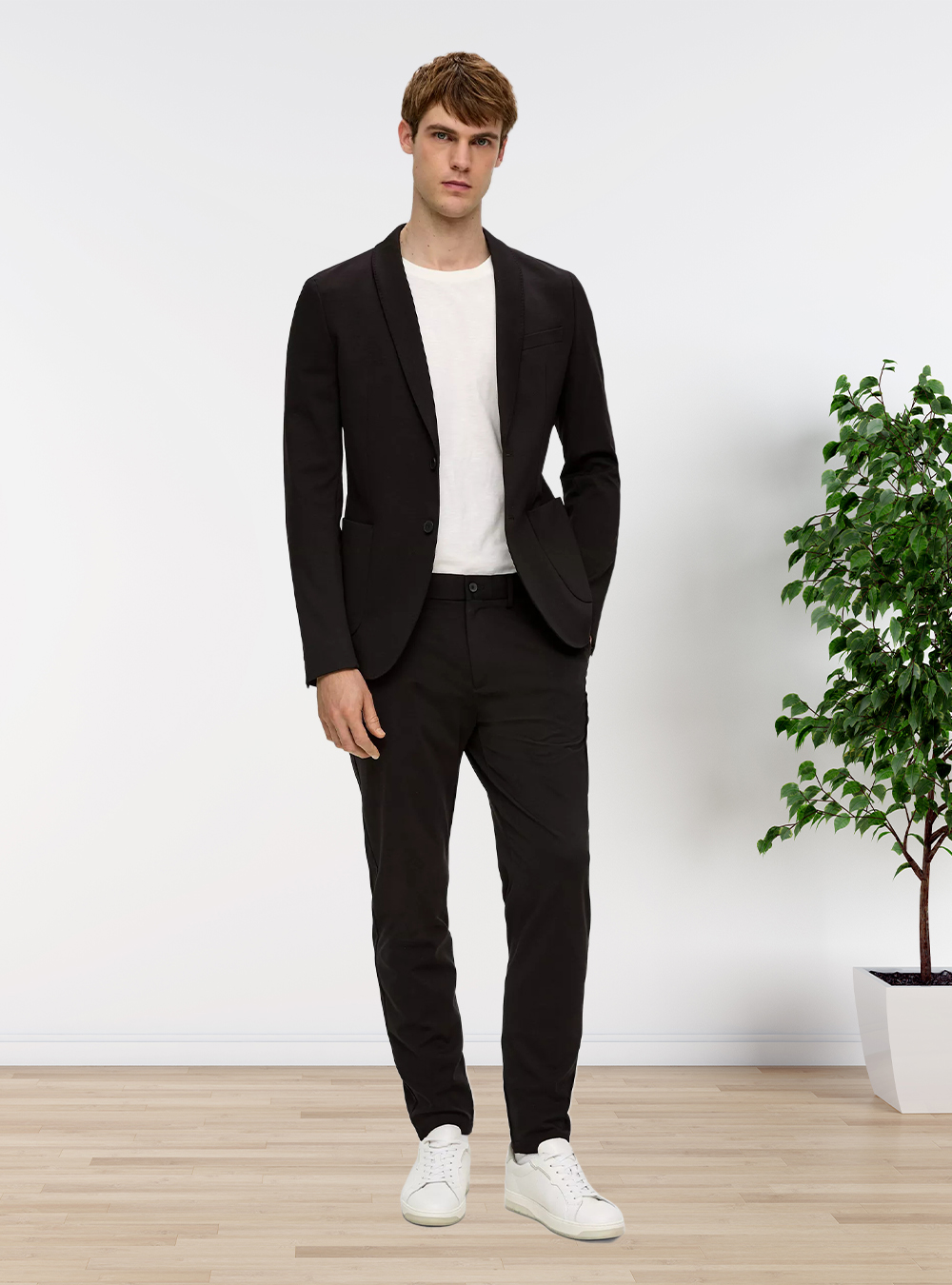 black suit, white crew-neck T-shirt, and white canvas sneakers