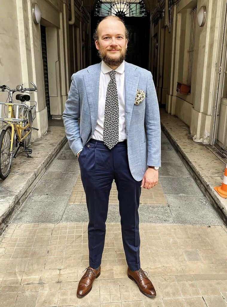 blue blazer, white shirt, navy pants, and brown full brogues