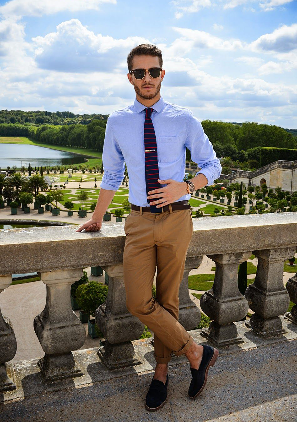 blue dress shirt, navy tie, khaki chinos, and navy loafers