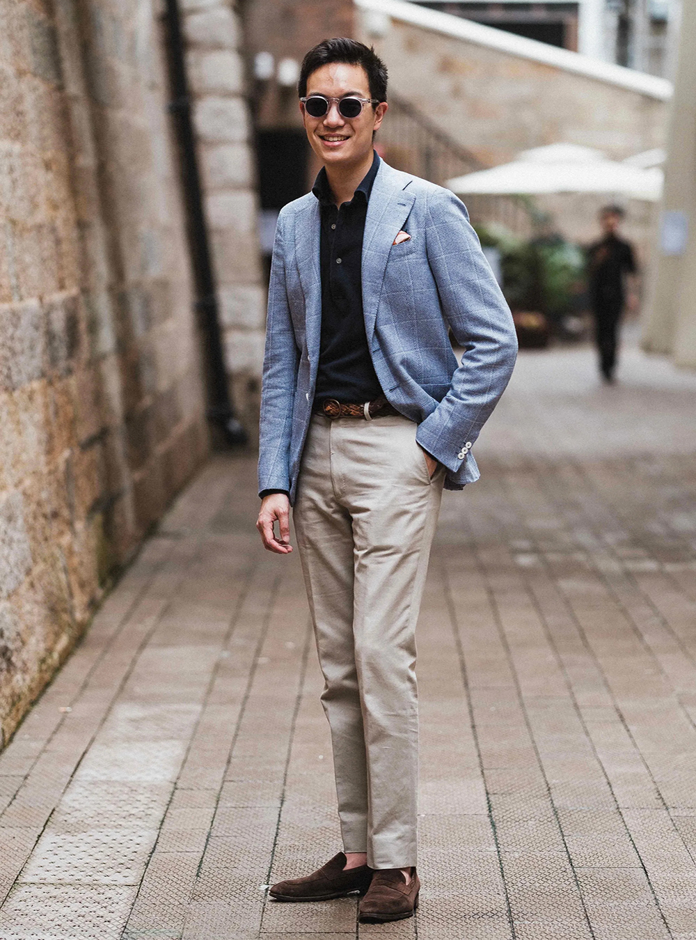 blue plaid blazer, black polo, tan chinos, and brown loafers