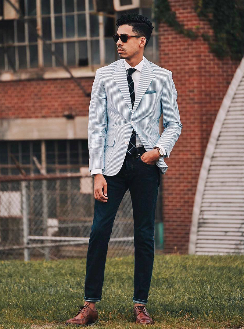 blue blazer, white shirt, and navy jeans with brown derby brogues