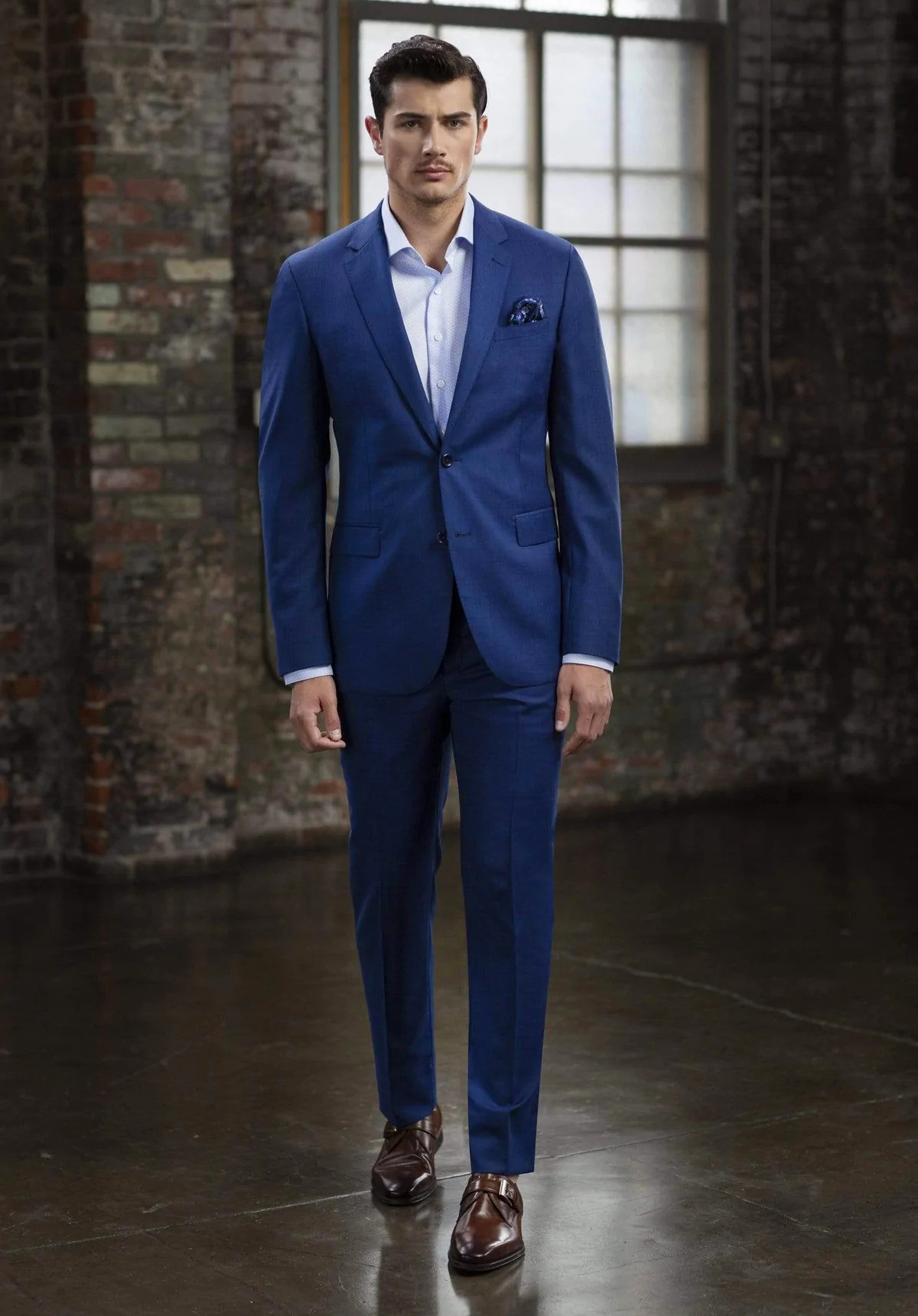 blue sharkskin suit with light blue herringbone shirt and brown monk straps