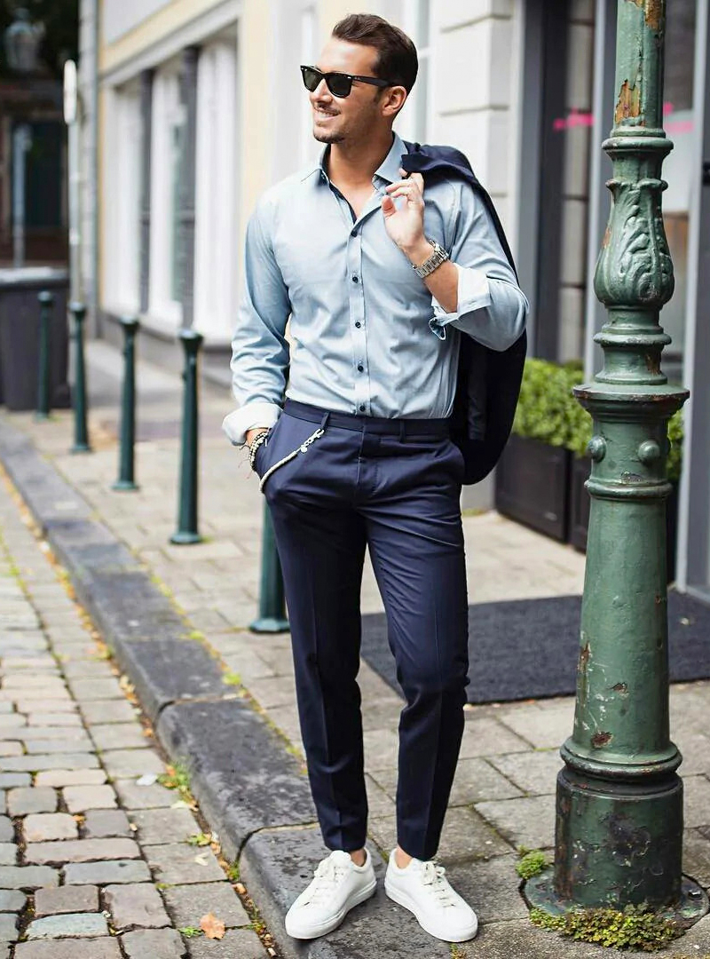 blue shirt, navy chinos, and white sneakers