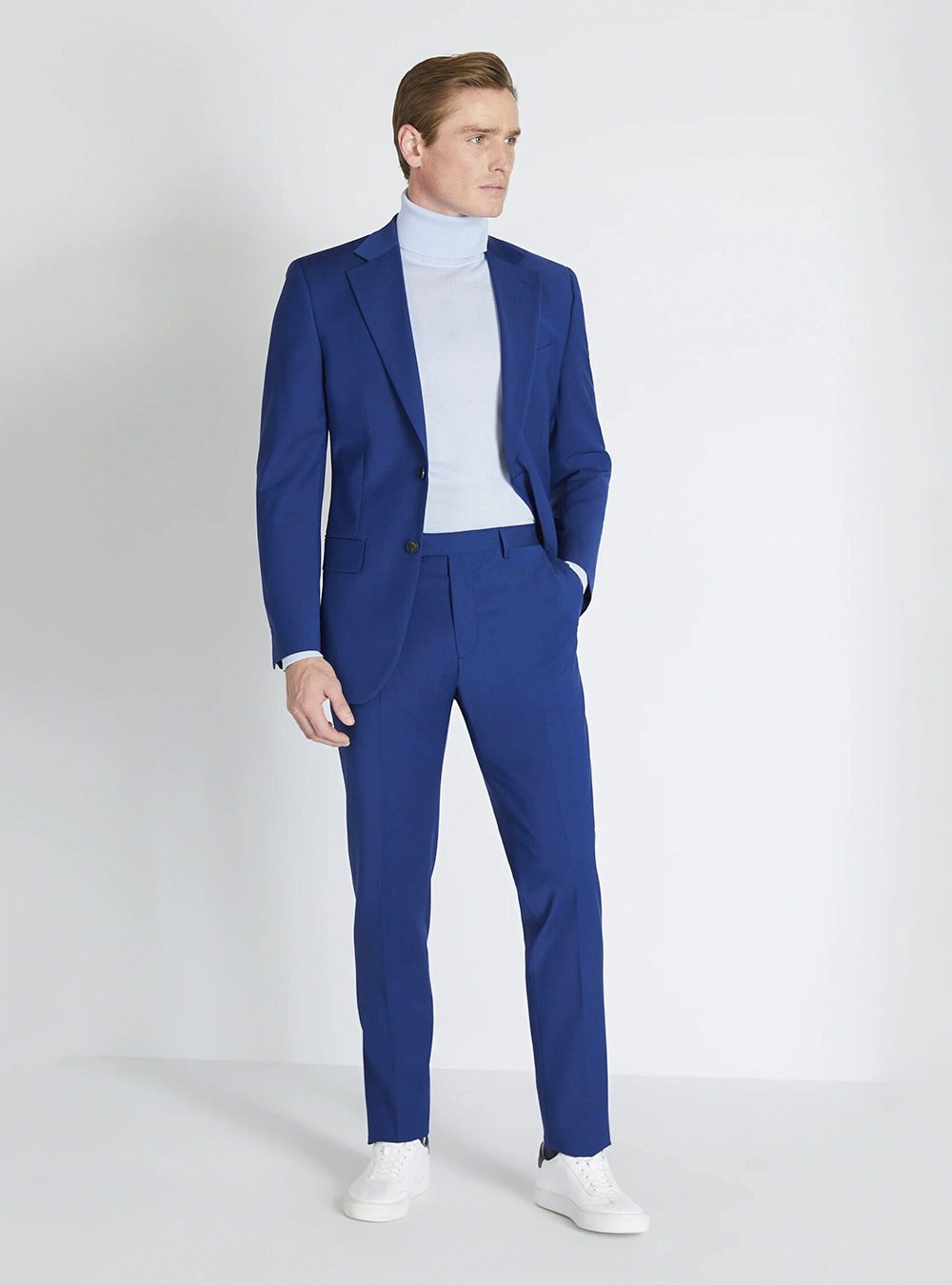 Blue suit, light blue turtleneck and white sneakers