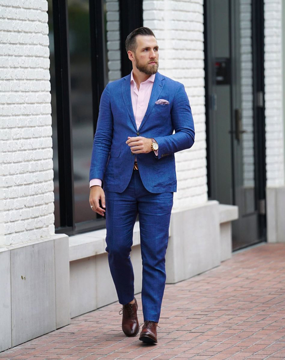 blue suit, pink dress shirt, and brown Oxford shoes