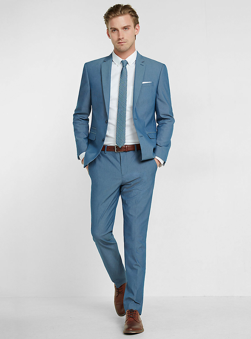 Blue suit, white dress shirt, blue tie and brown derby shoes