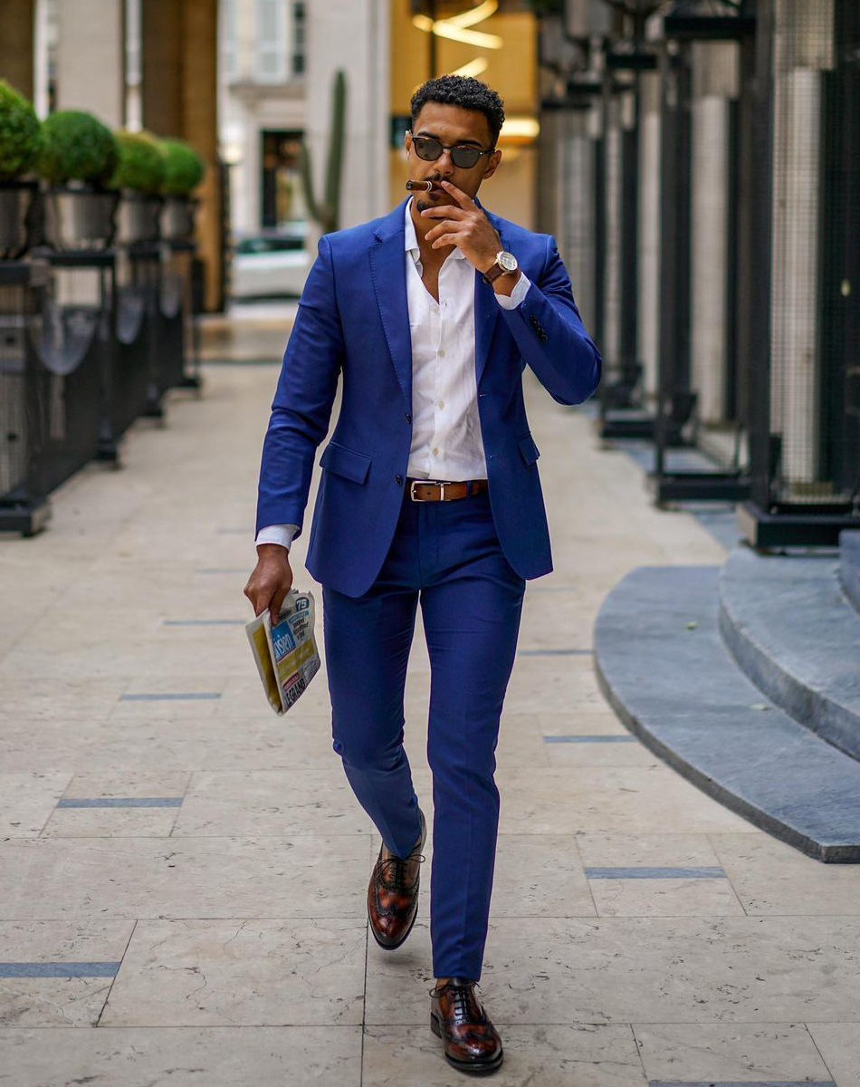 blue suit, white dress shirt, and brown brogue Oxford shoes