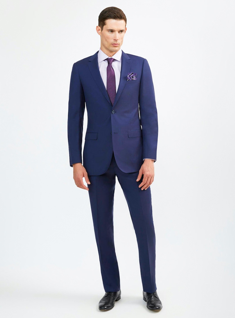 Blue suit, white dress shirt, purple dotted tie and black derby shoes
