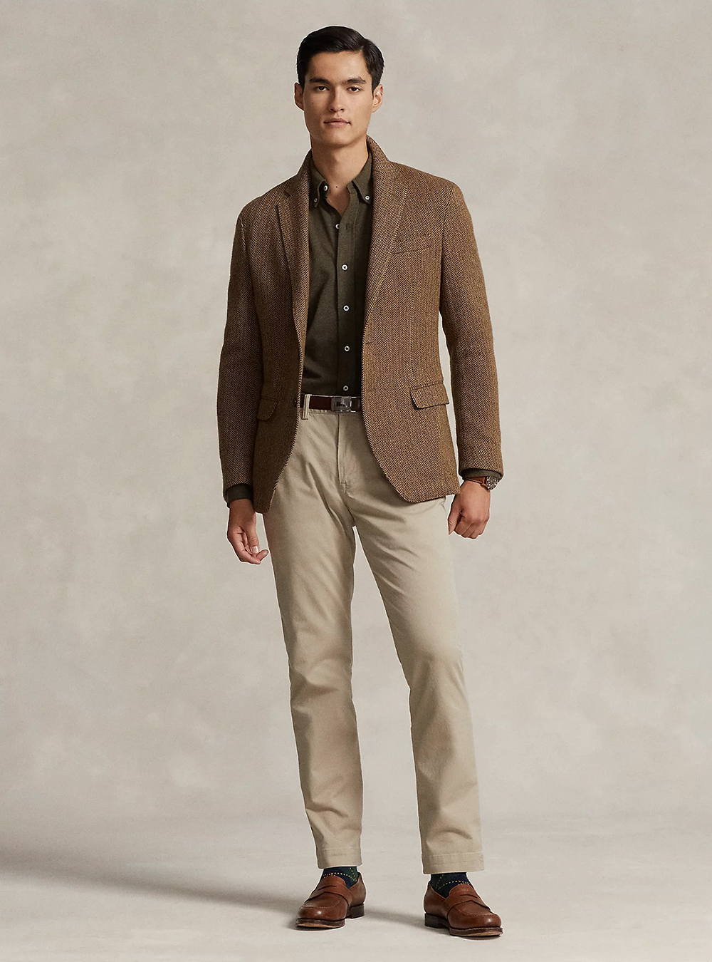 brown blazer, button-down olive shirt, tan chinos, and brown loafers