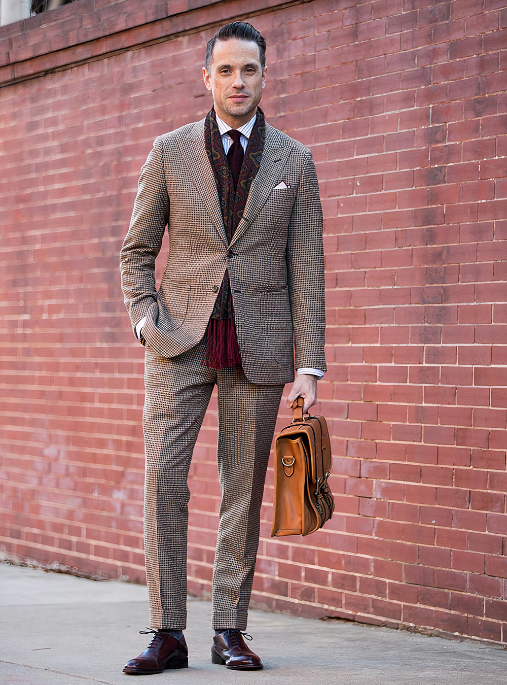 brown houndstooth suit, burgundy plaid scarf, and burgundy Oxford shoes