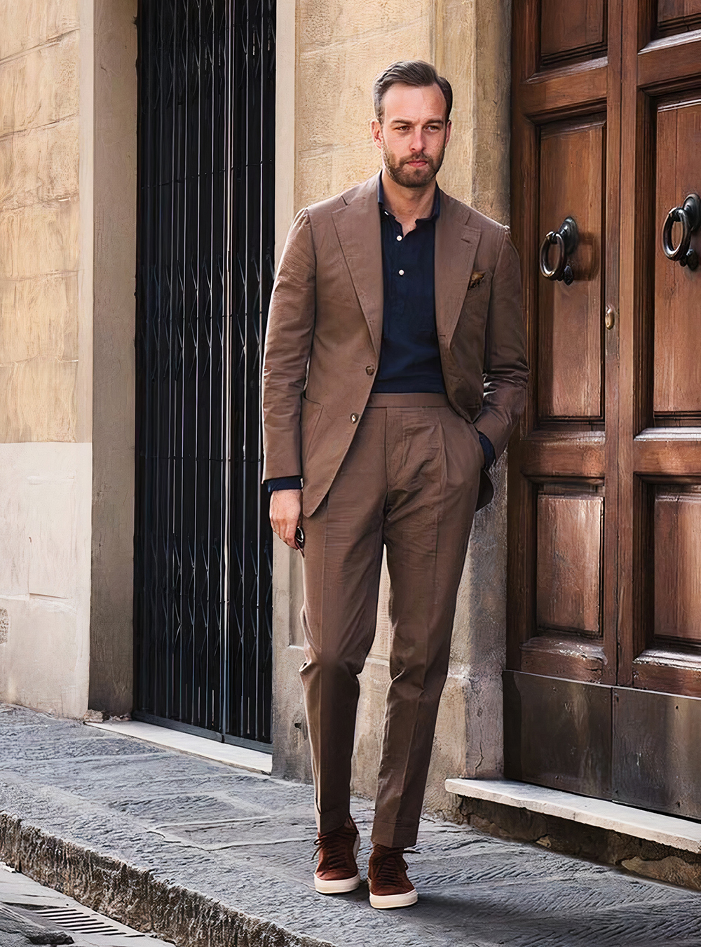 brown suit, navy polo shirt, and brown sneakers