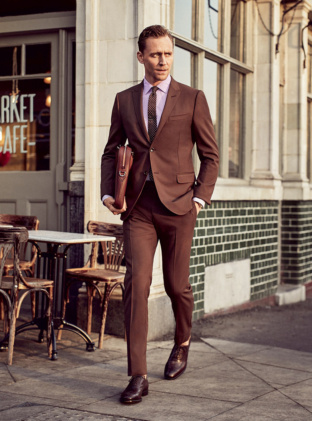 brown suit, pink shirt, and brown Oxford shoes