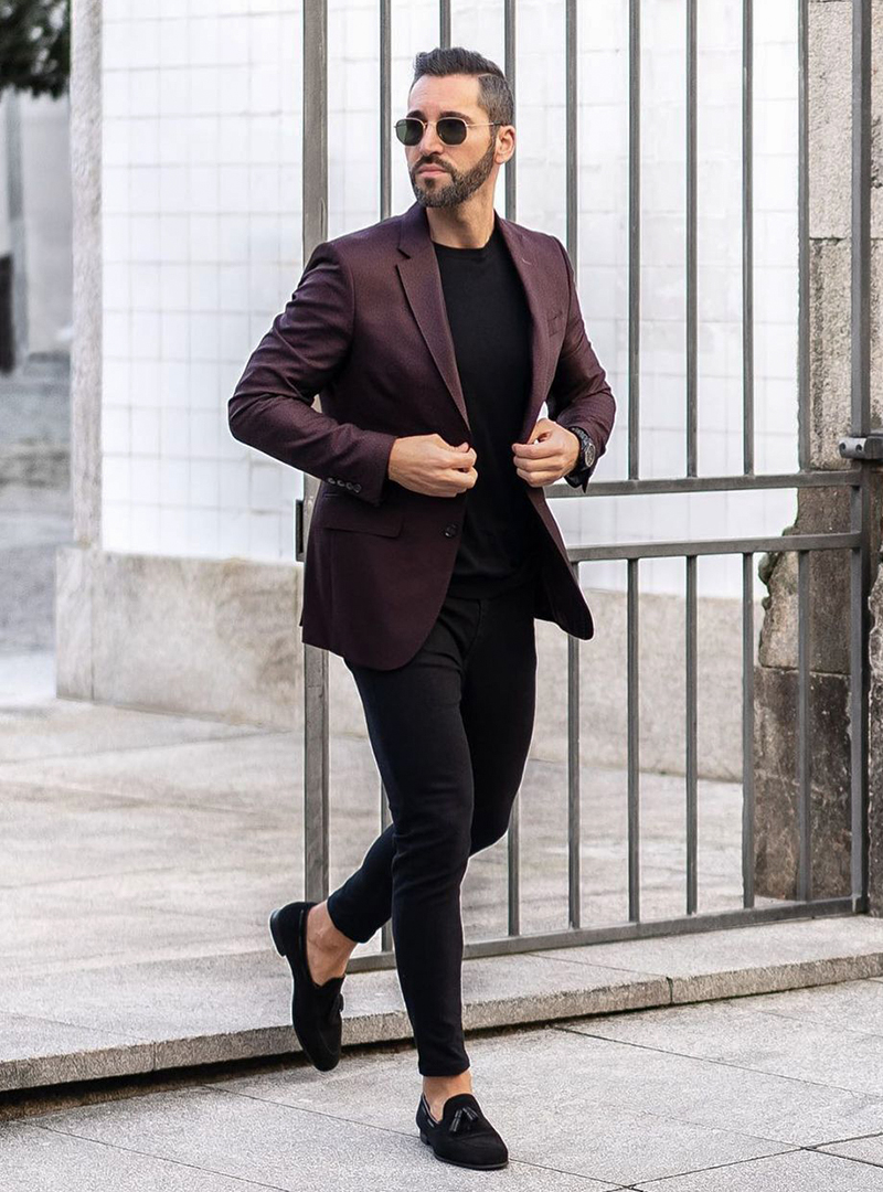 burgundy blazer, black T-shirt, black jeans, and black loafers