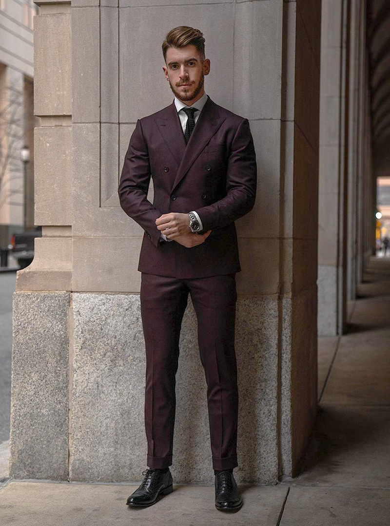 burgundy suit, white shirt, black tie, and black oxford brogues
