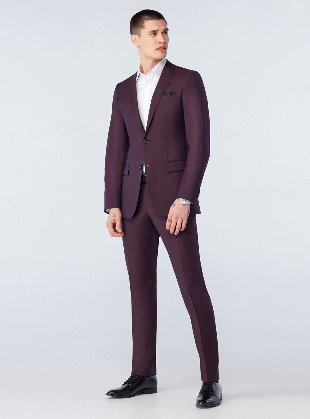 Burgundy suit, white dress shirt and black derby shoes