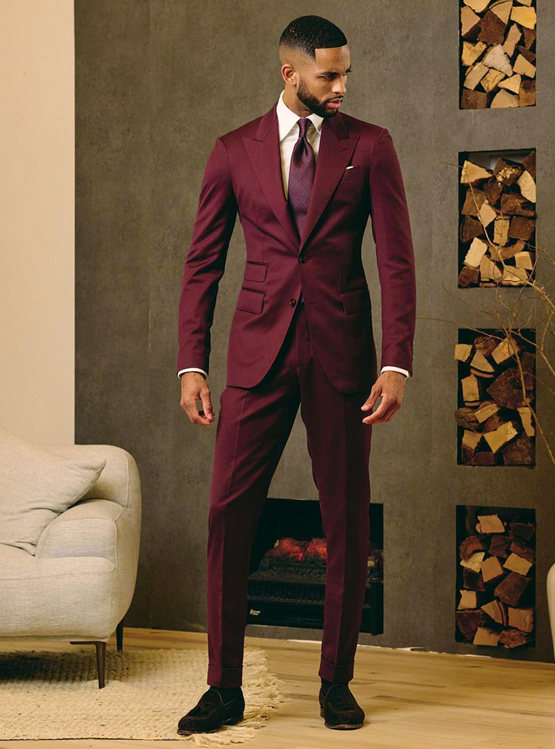 Burgundy suit, white dress shirt, burgundy tie and brown loafers