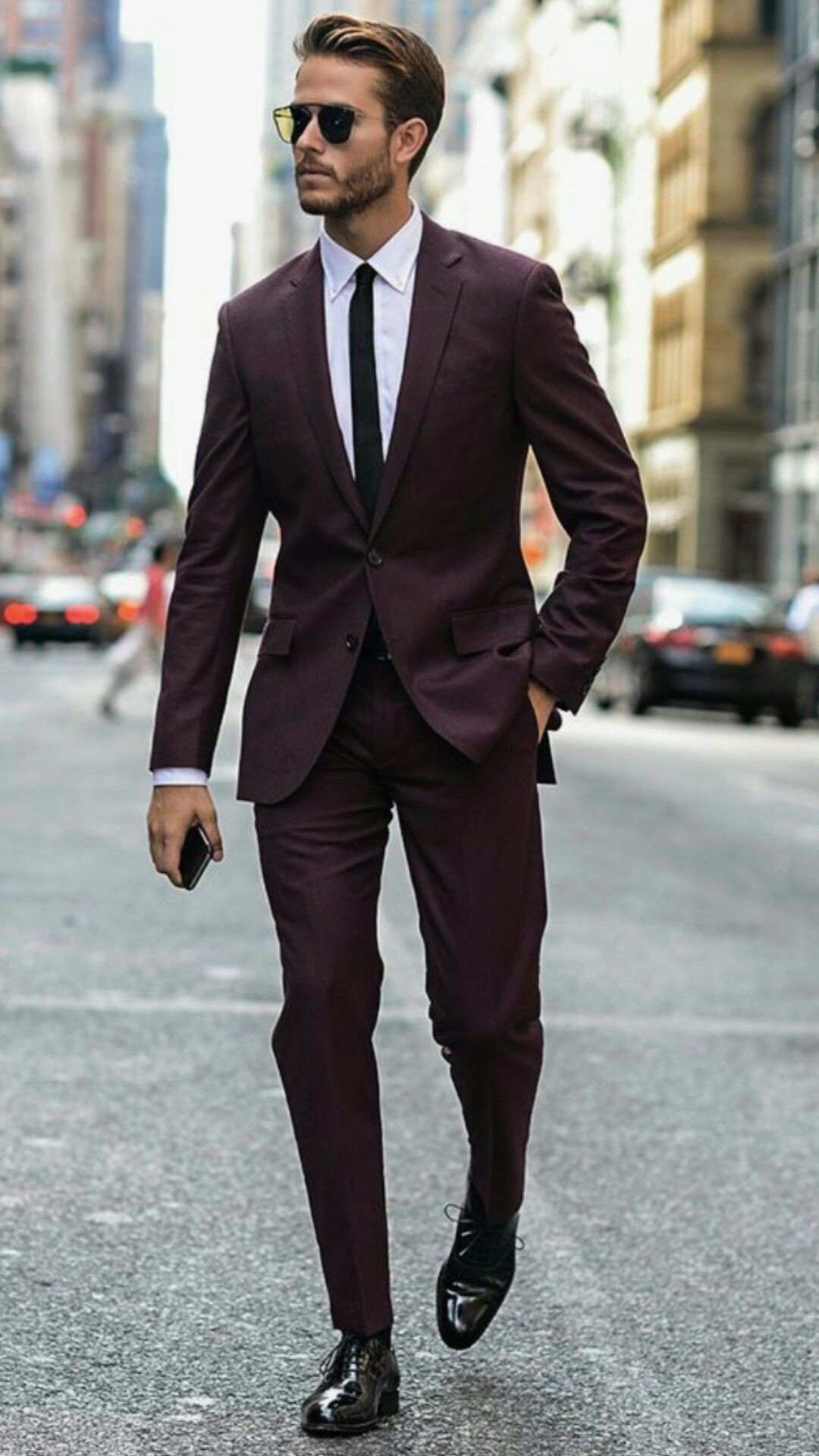 burgundy suit, white shirt, black oxford shoes, and black tie