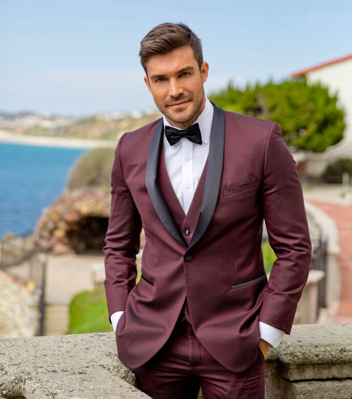 Burgundy tuxedo worn as a wedding attire