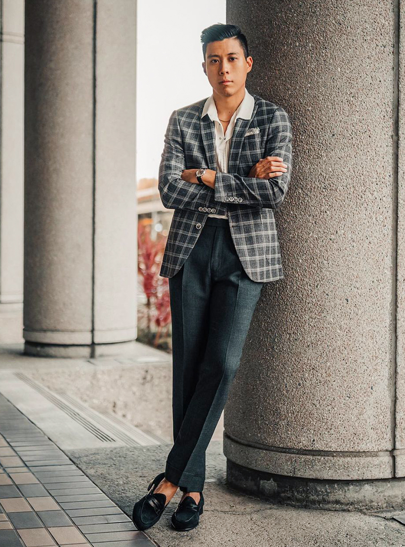 charcoal plaid blazer, white polo shirt, charcoal pants, and black loafers