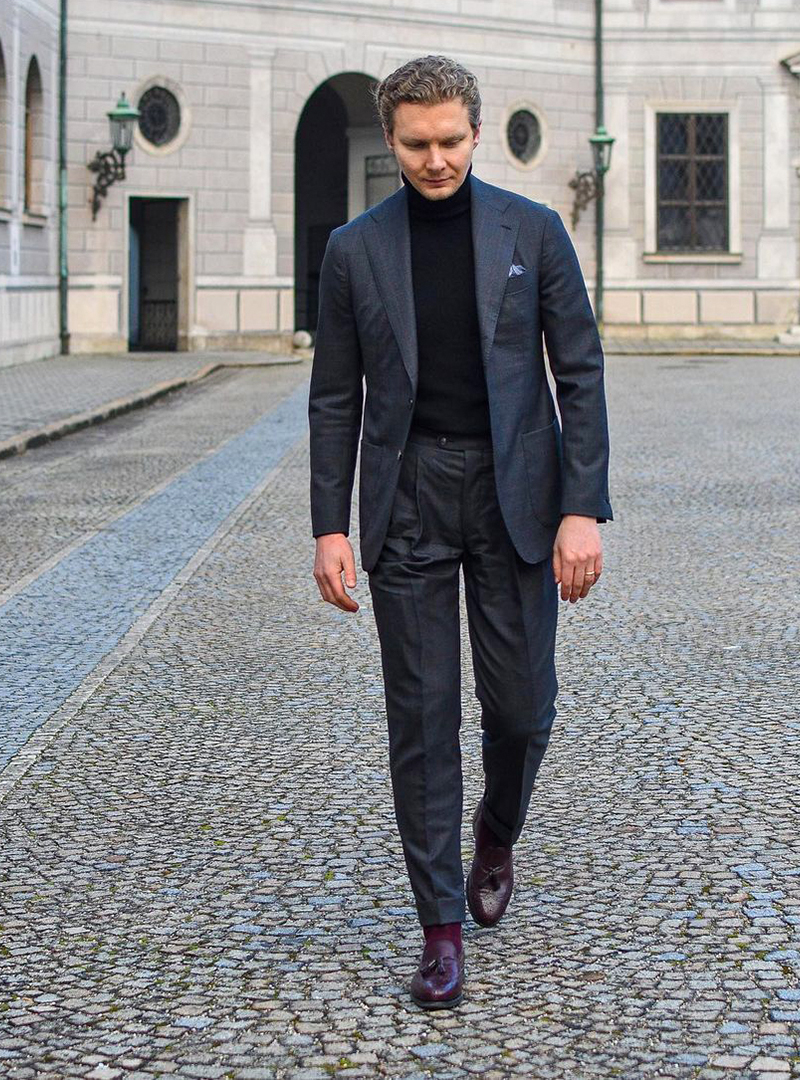 Charcoal suit, black turtleneck, and burgundy loafers