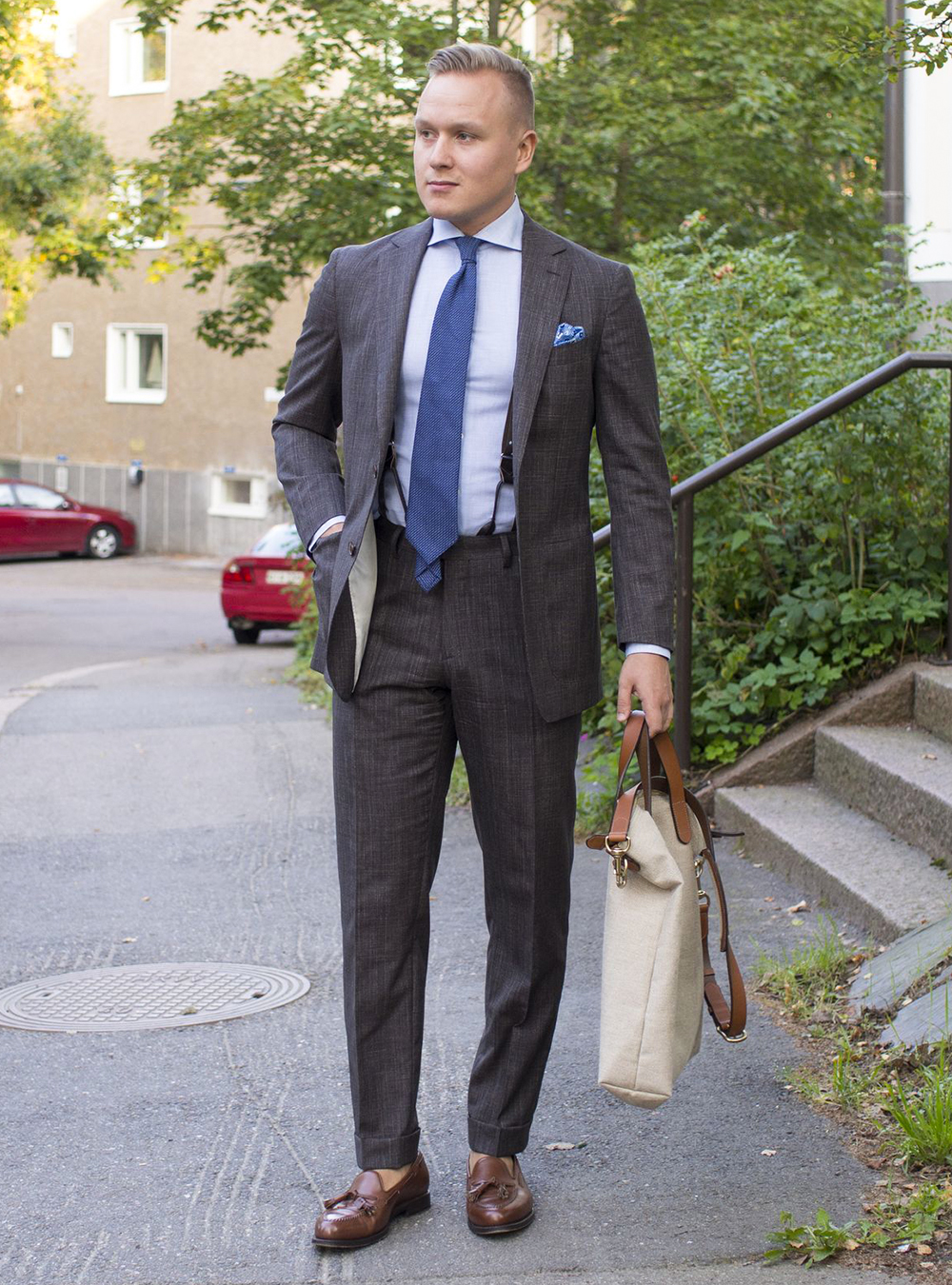 Charcoal suit, light blue dress shirt, blue tie and dark brown loafers