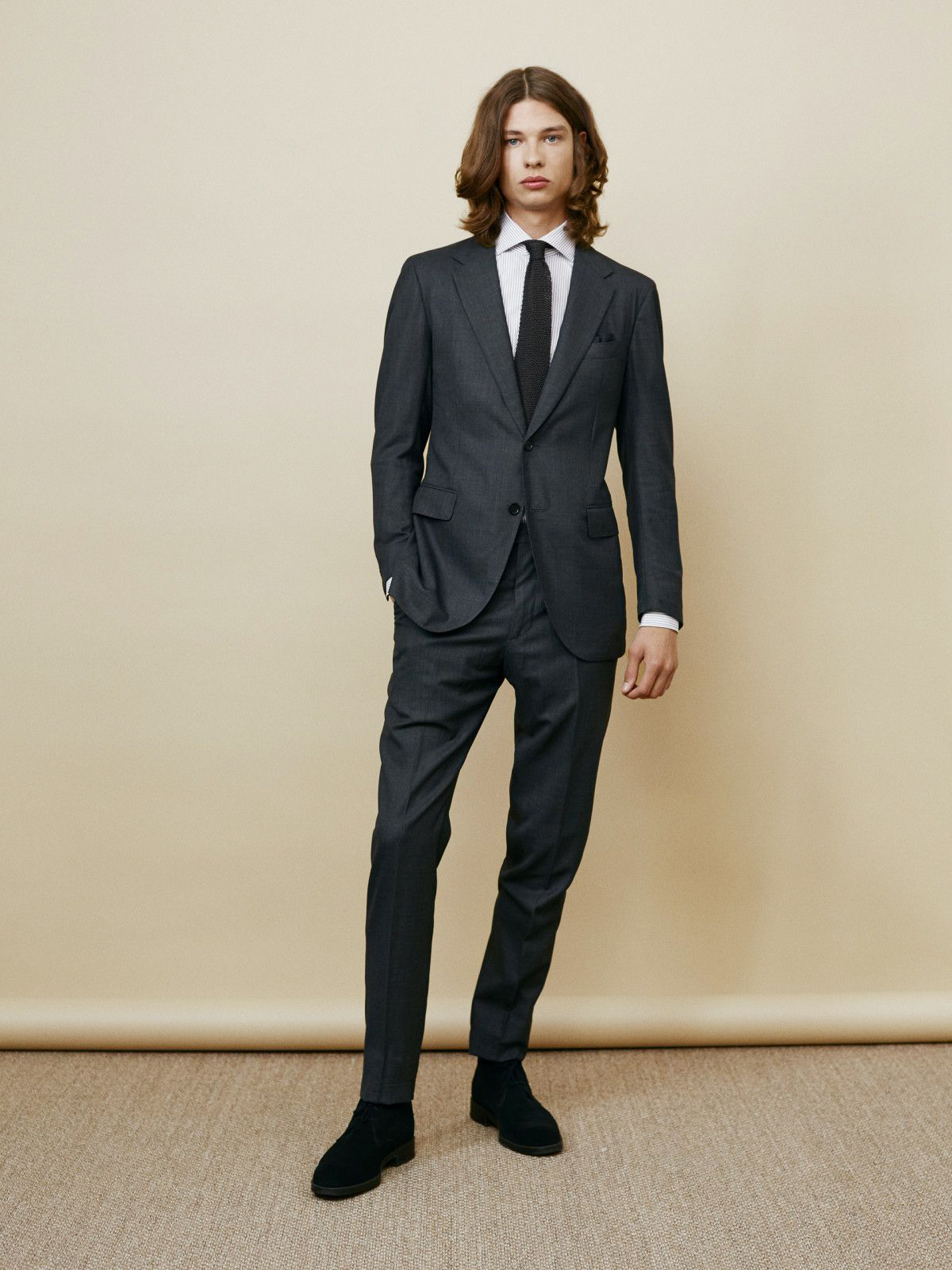 charcoal suit with white dress shirt and black suede chukka boots