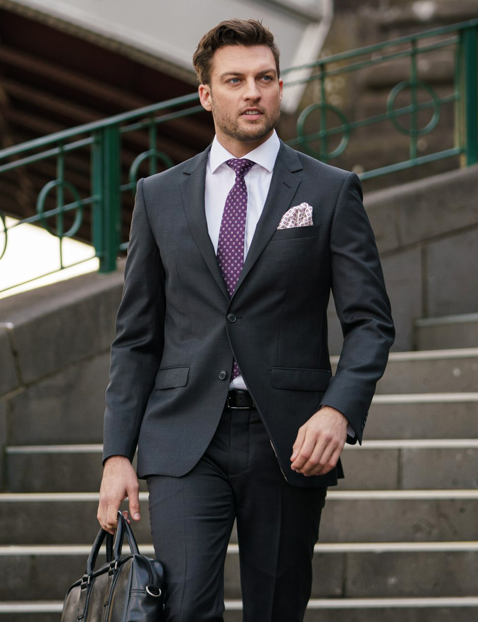 matching a charcoal wool suit with a purple tie for versatility
