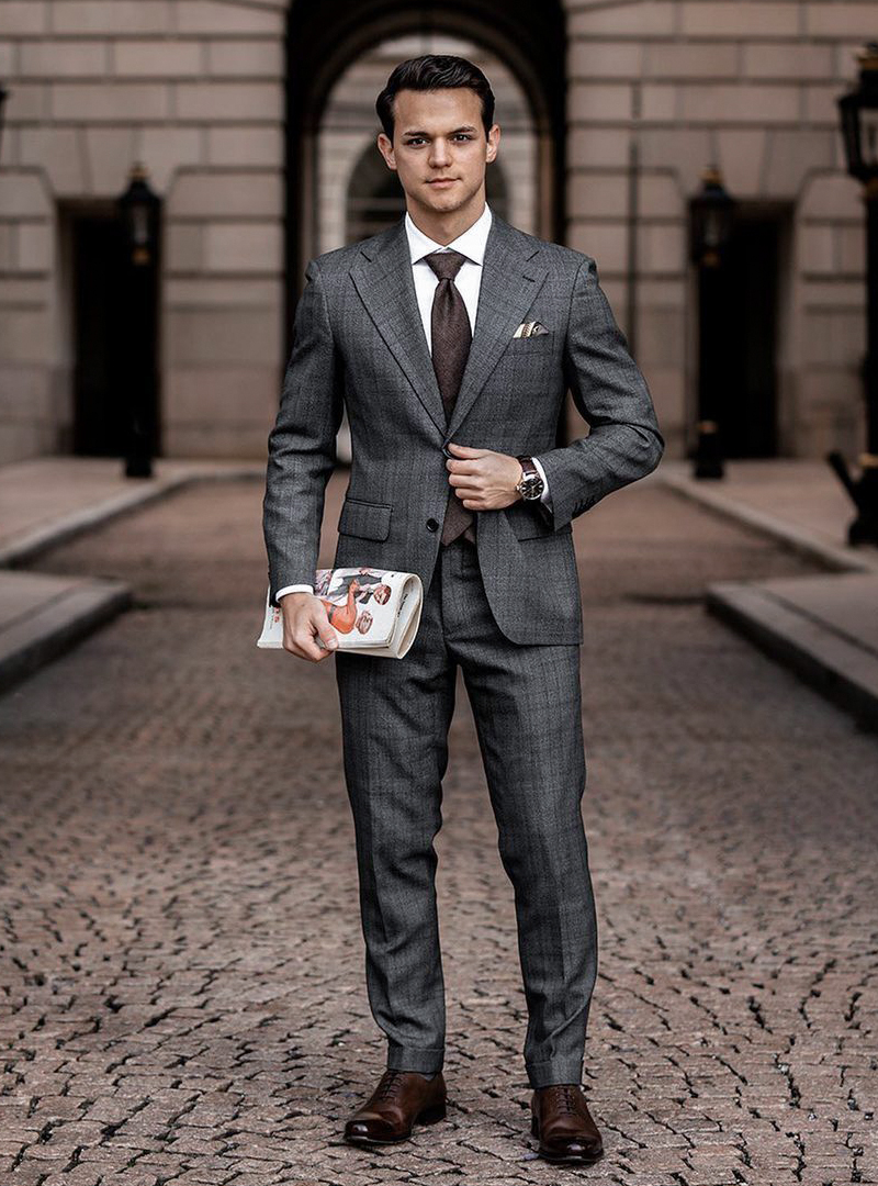 charcoal suit, white shirt, and brown Oxford shoes