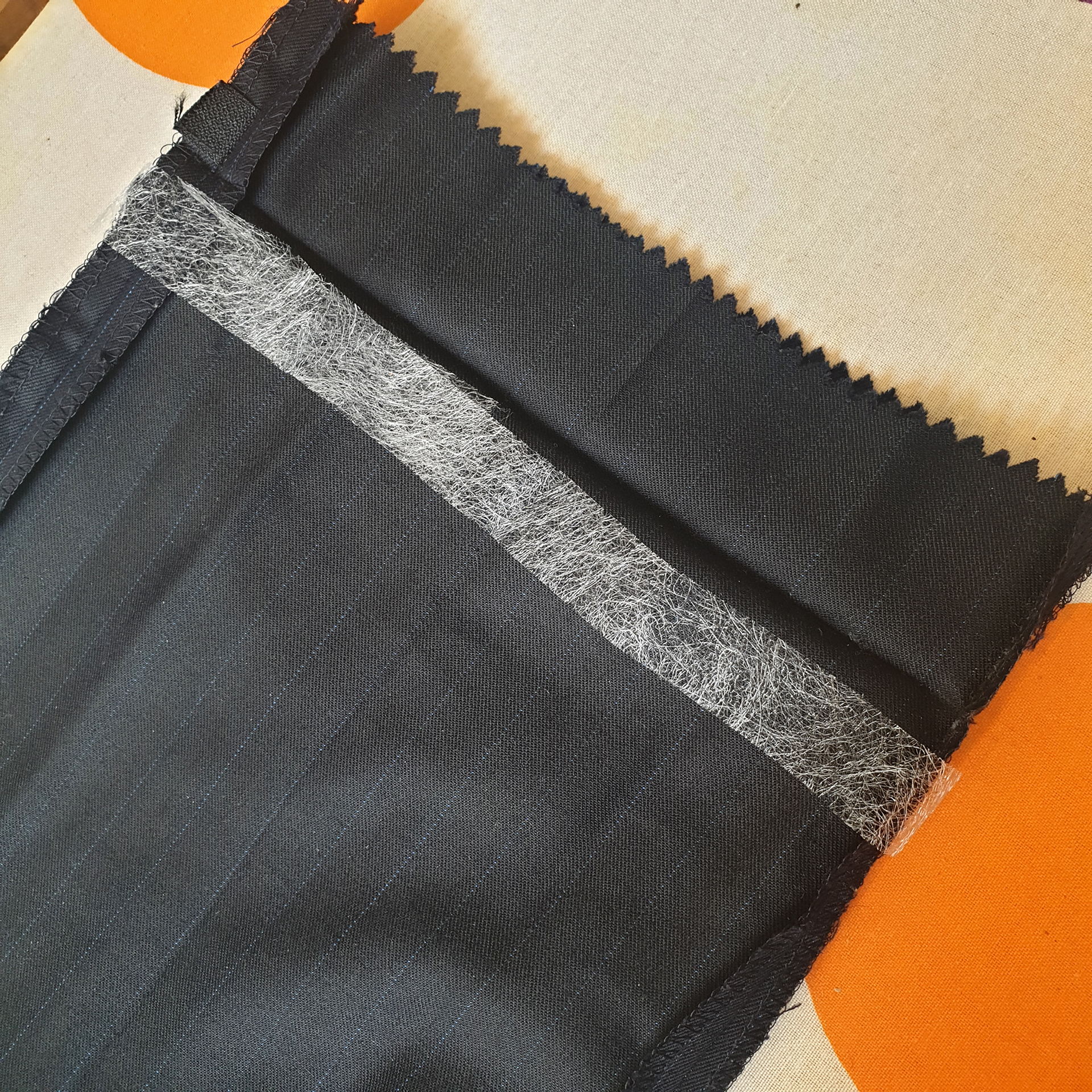 cut the exact amount of fabric tape to hem your suit pants