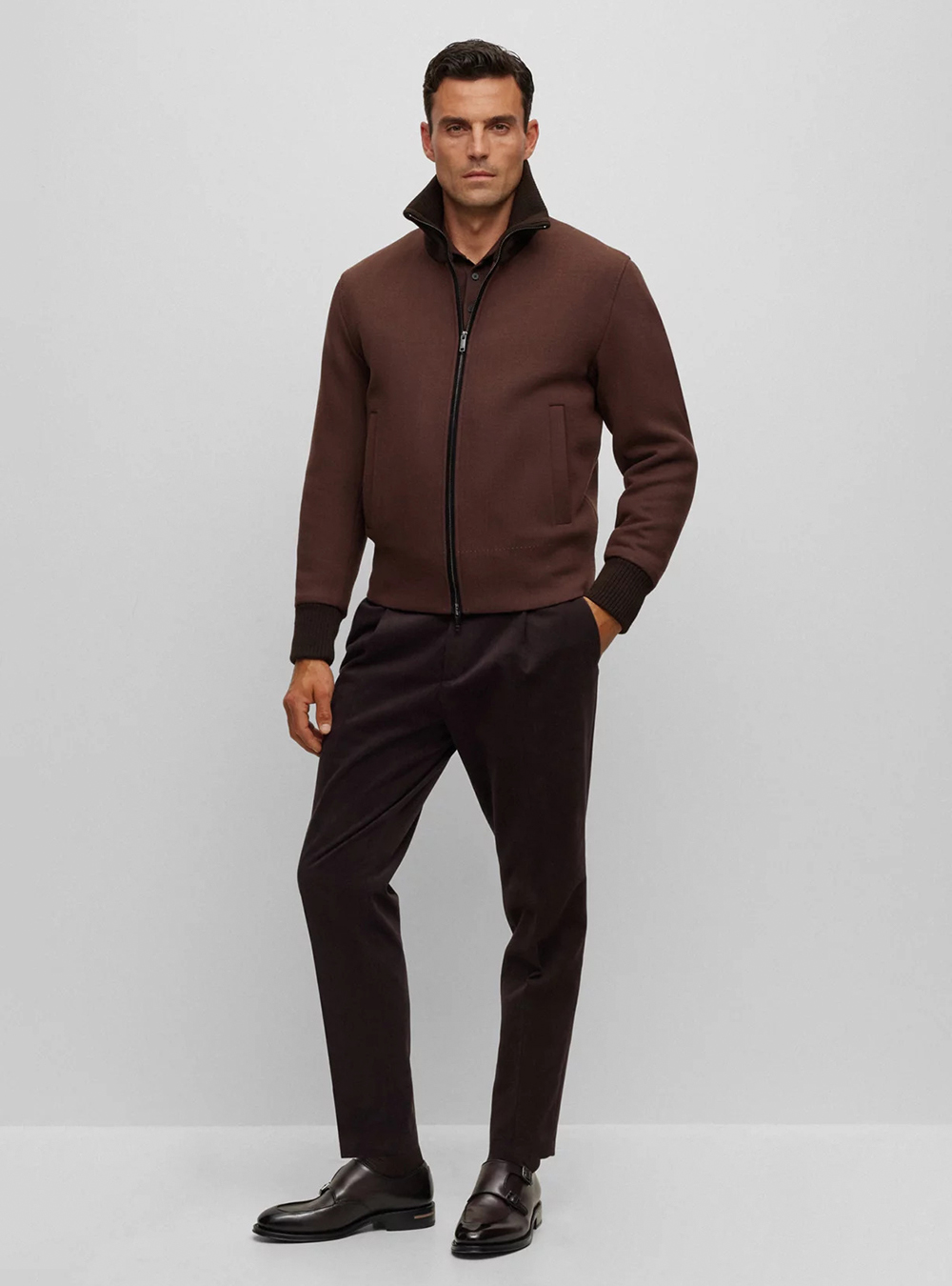 brown jacket, polo t-shirt, pants. and monk straps