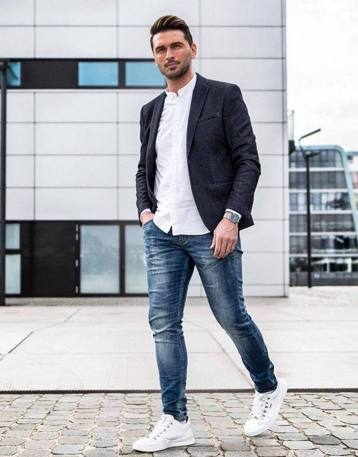 Dark grey sport coat, white casual shirt, and blue jeans