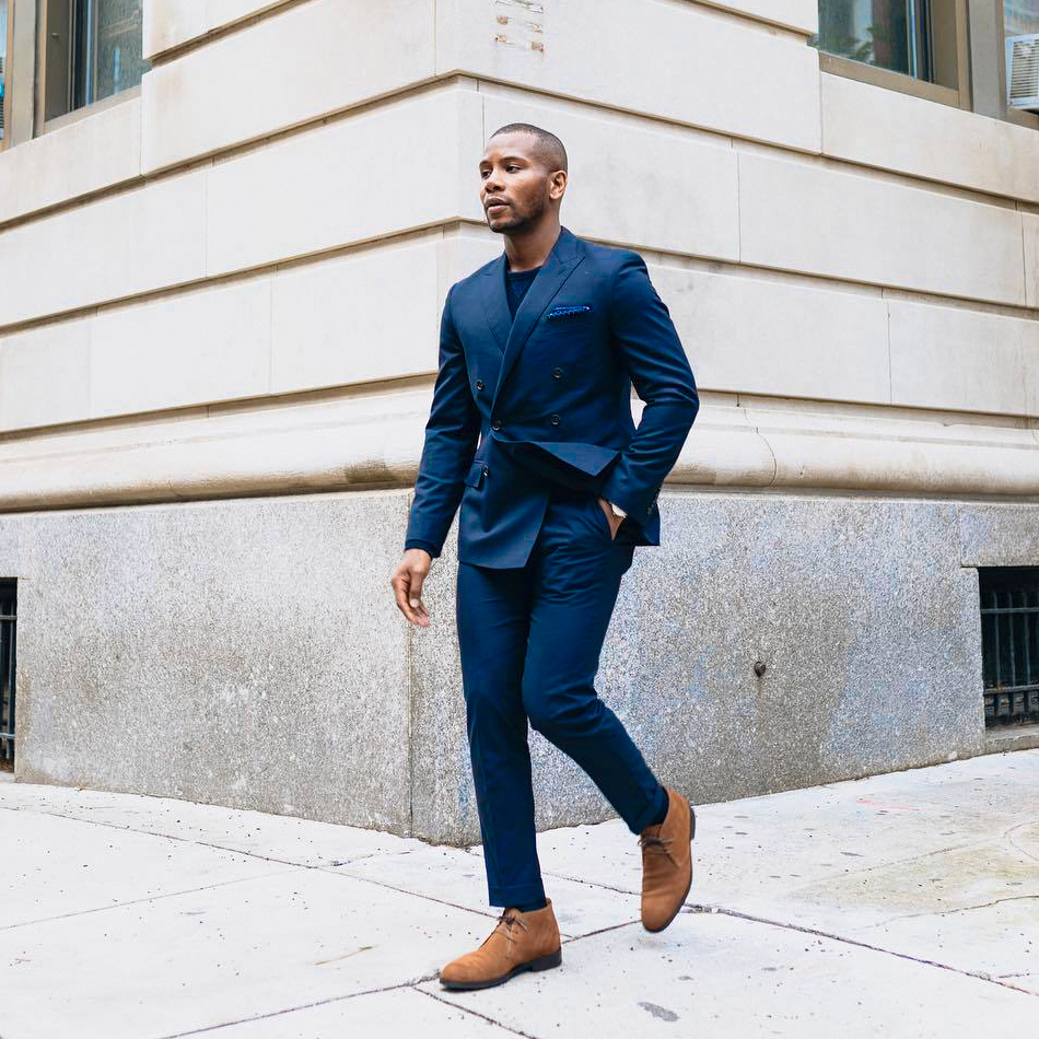 double-breasted blue suit with long sleeve t-shirt and brown/desert chukka boots