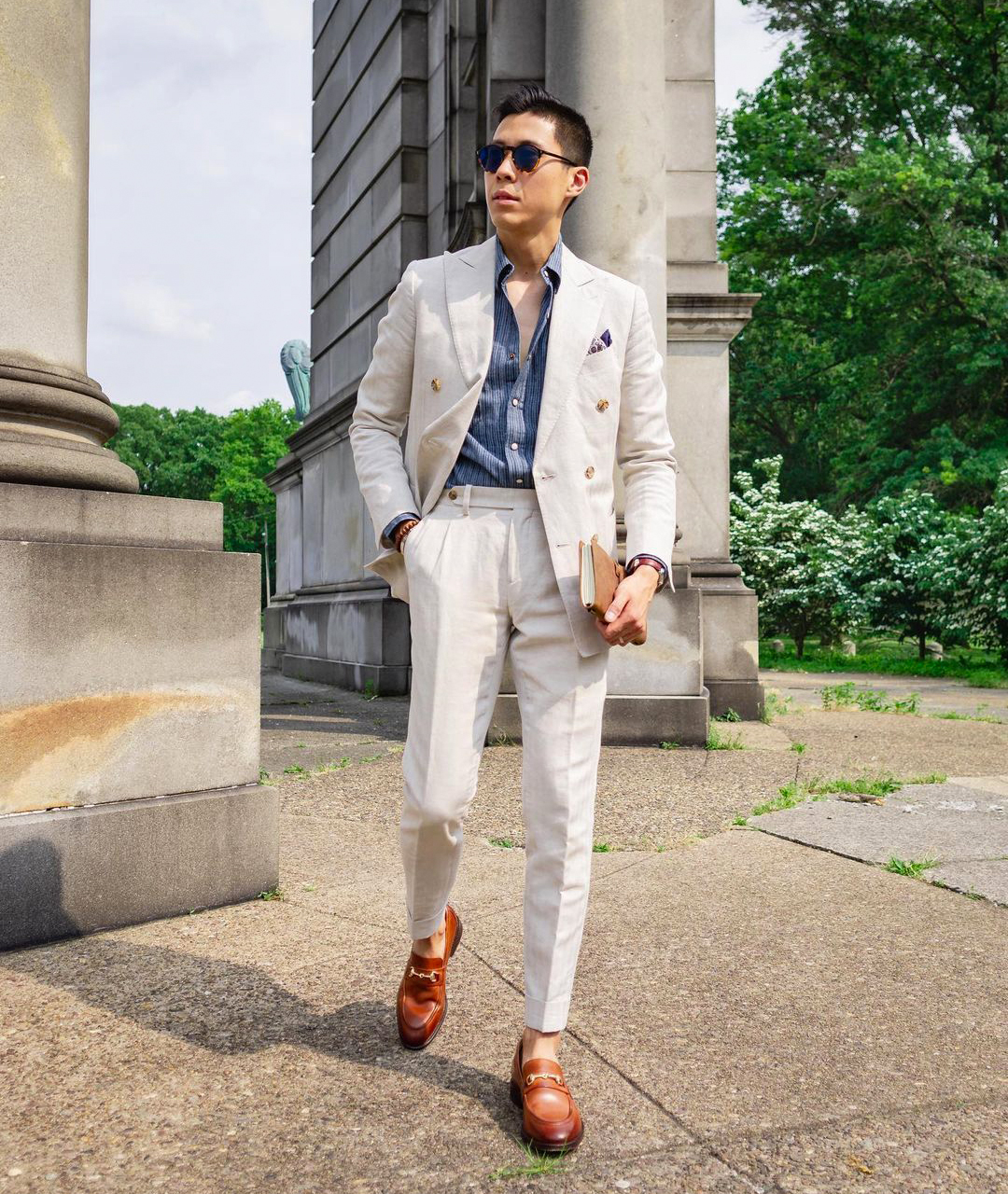 double-breasted suit with casual blue shirt and brown loafers