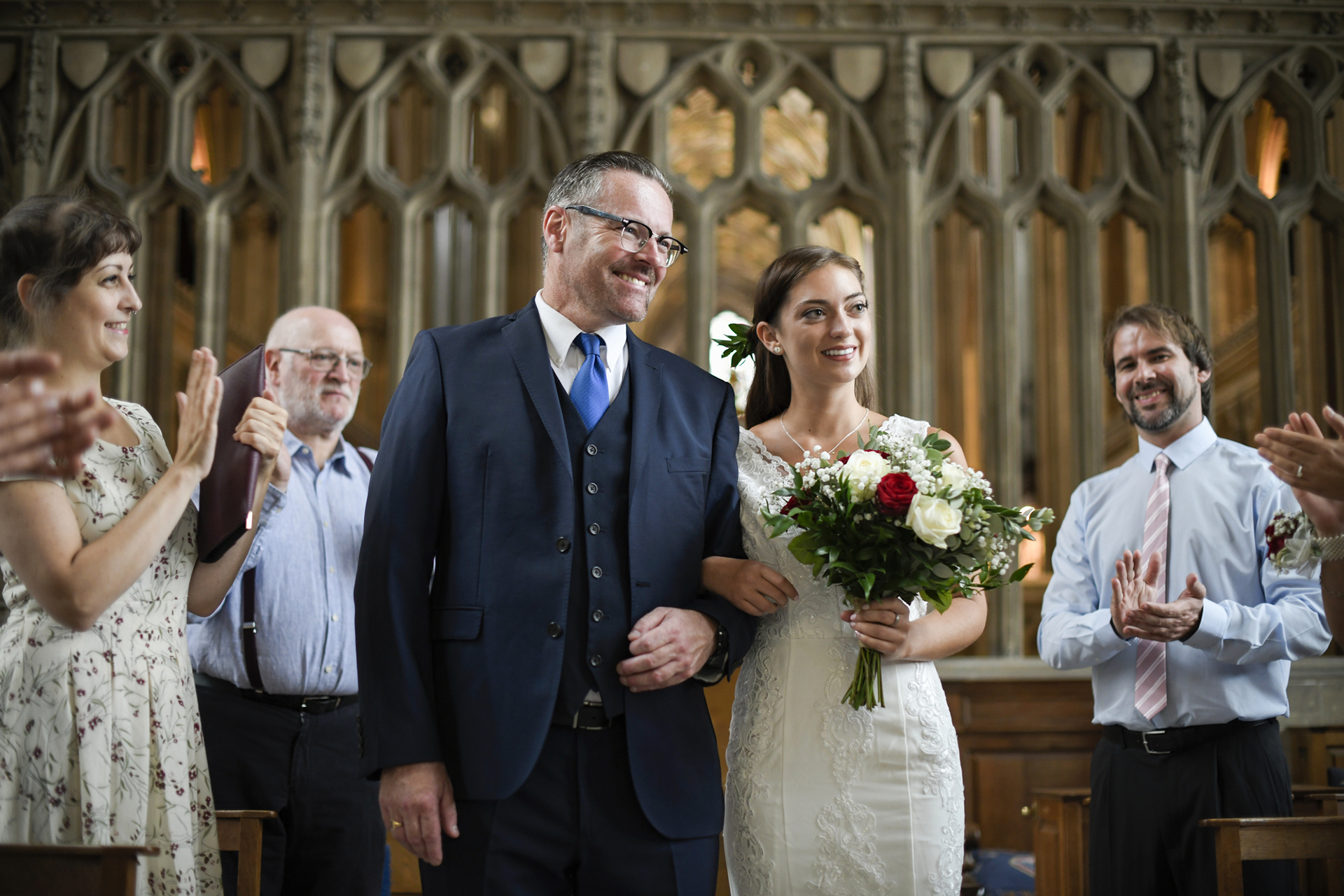 father of the bride in a three-piece navy suit