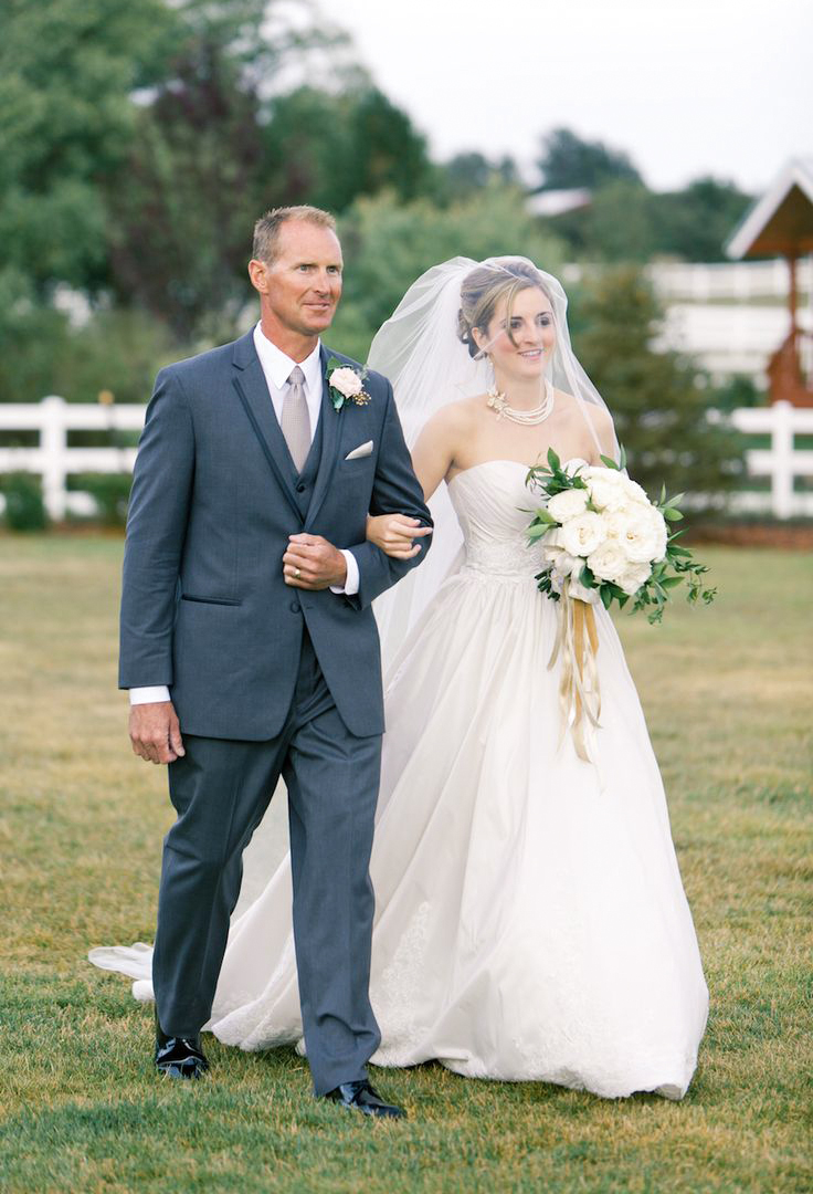 father of the bride wearing charcoal grey suit and white shirt