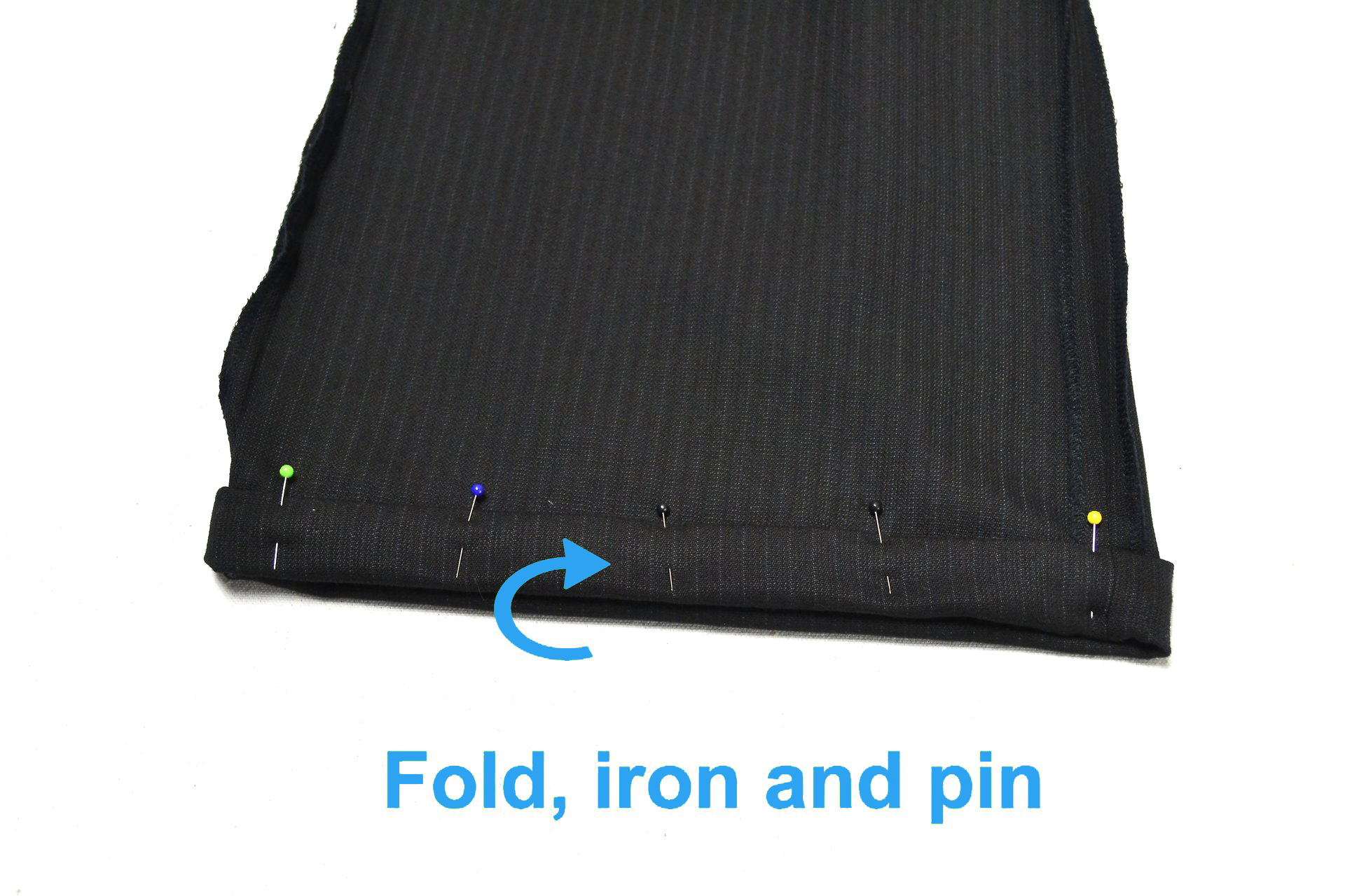 folding pants and placing straight pins